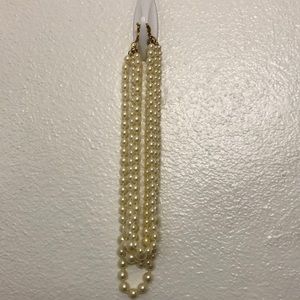 Multi strand cream colored faux pearl necklace